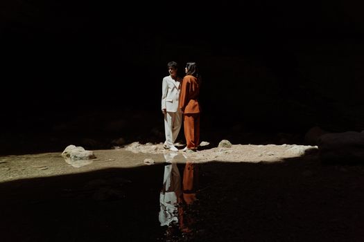 Women Standing inside the Cave