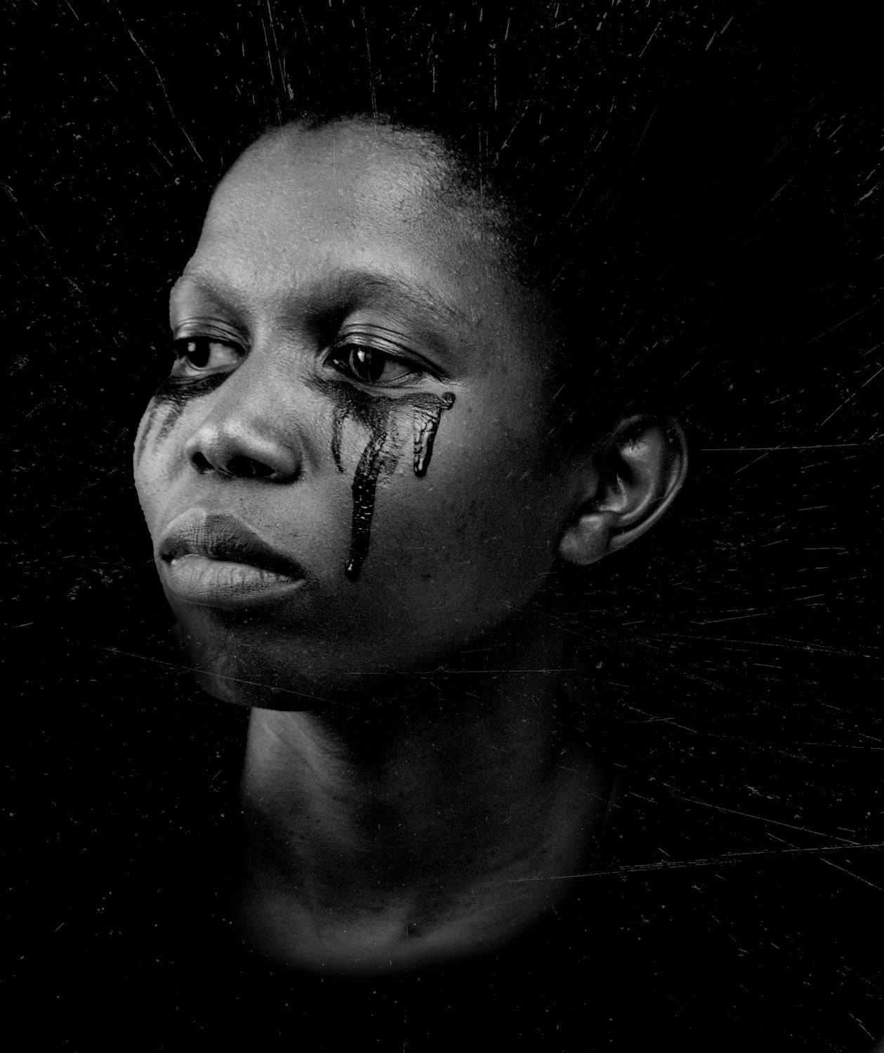 tears on the rolling down the cheeks of an abused woman