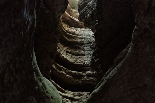 Free Explore the stunning rock formations inside a cave in the Caucasus Mountains. Ideal for adventure and nature enthusiasts. Stock Photo