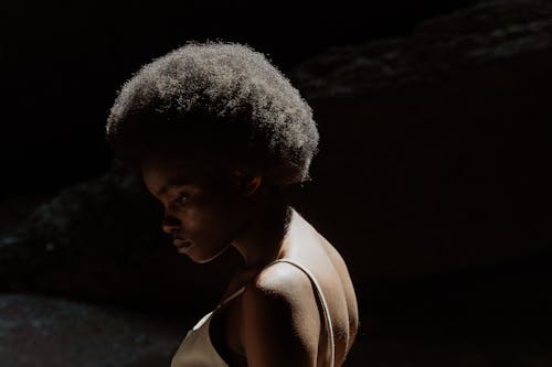 Close-up Photo of a Beautiful Woman with Afro Hairstyle