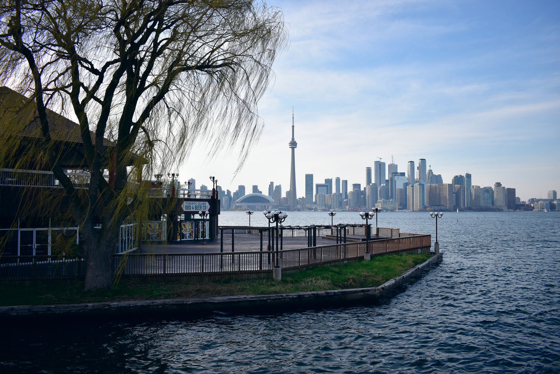 Toronto waterfront football viewing party, giant screen, diverse fans, summer evening atmosphere