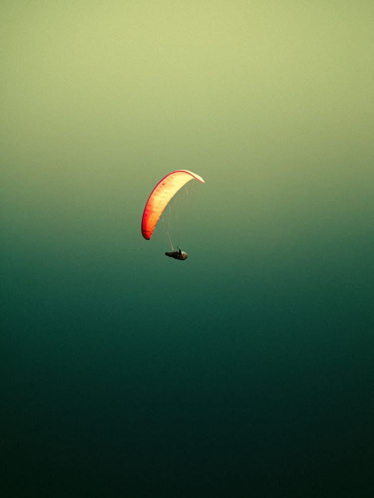 Parachute Flying On Sky Background