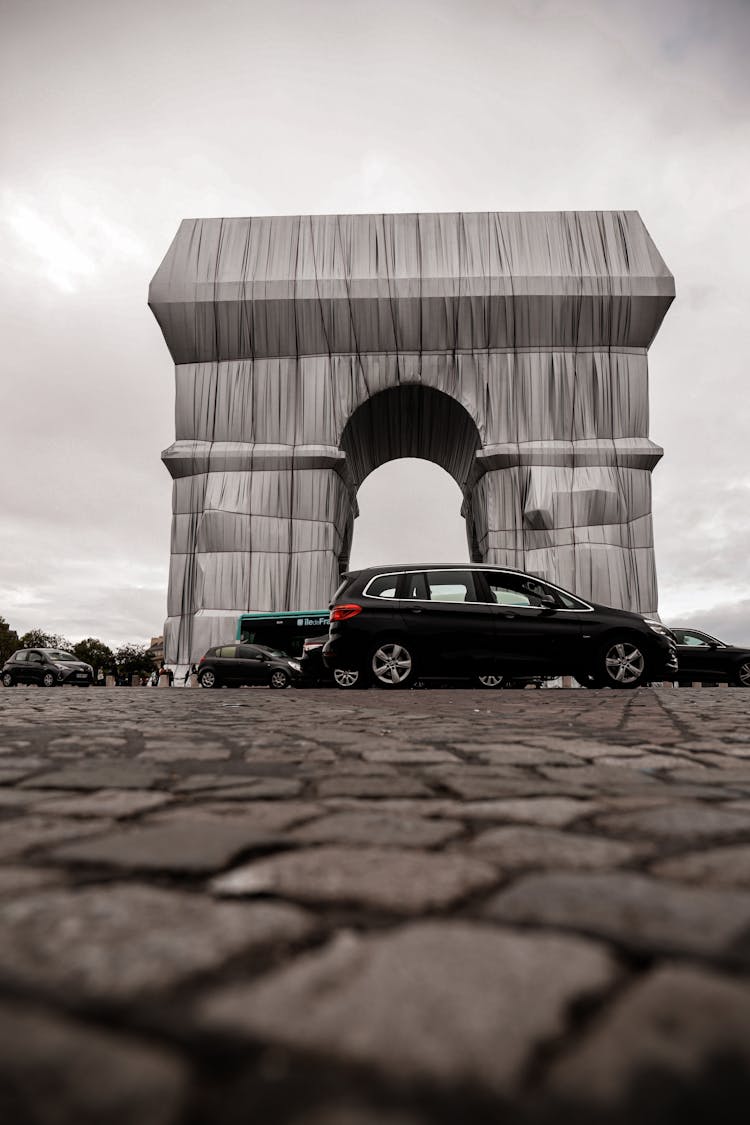 Cars Passing Wrapped Arc De Triomphe