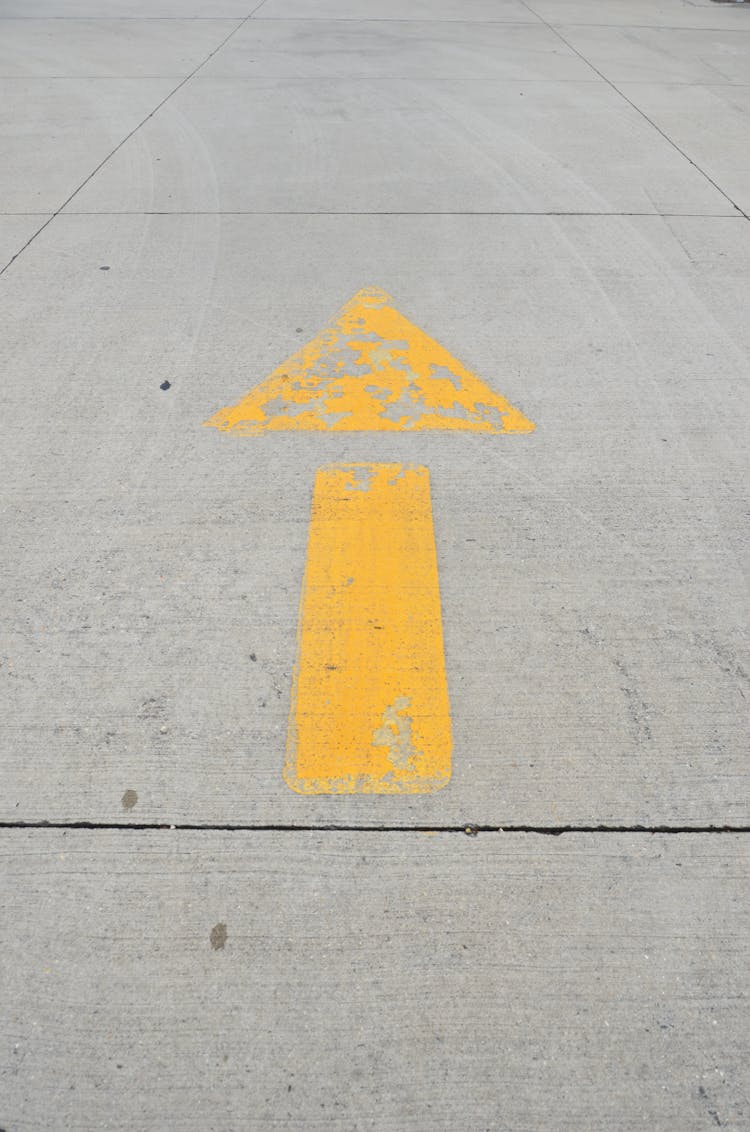 Road Sign On Asphalt