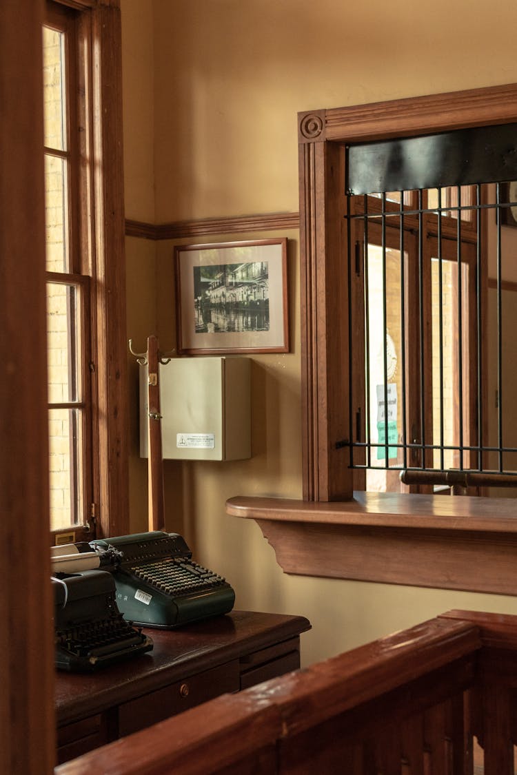 Vintage Typewriters On A Wooden Desk