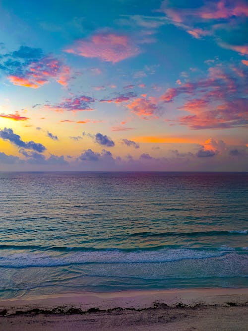 Free Body of Water Under Blue Sky during Sunset Stock Photo