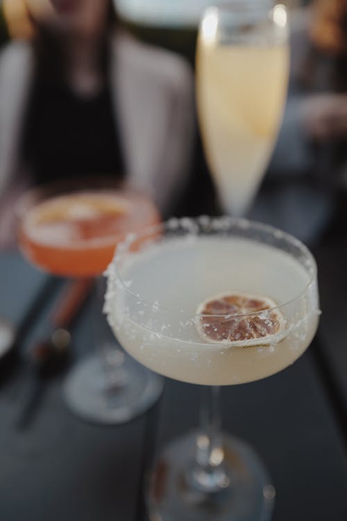 Different Types of Cocktail Drinks on a Wooden Surface