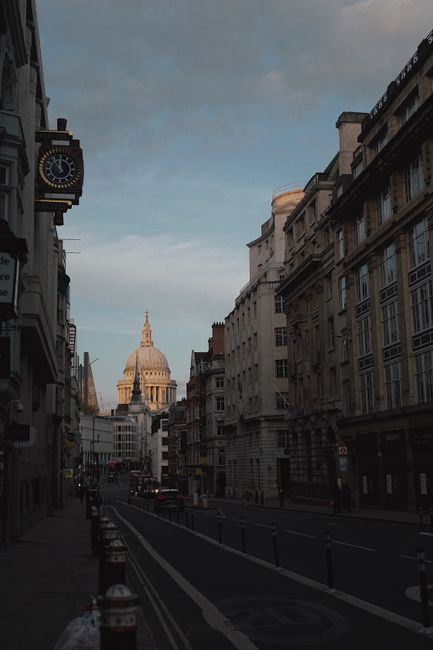 Street view of London featuring St. Paul's Cathedral at dusk, capturing the city's architecture.