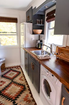 Modern kitchen interior in a cozy Catskill home with wooden elements.
