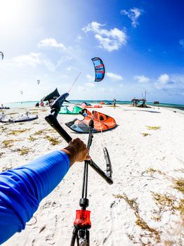 Experience the thrill of kiteboarding with a point-of-view shot on a sunny Venezuelan beach.
