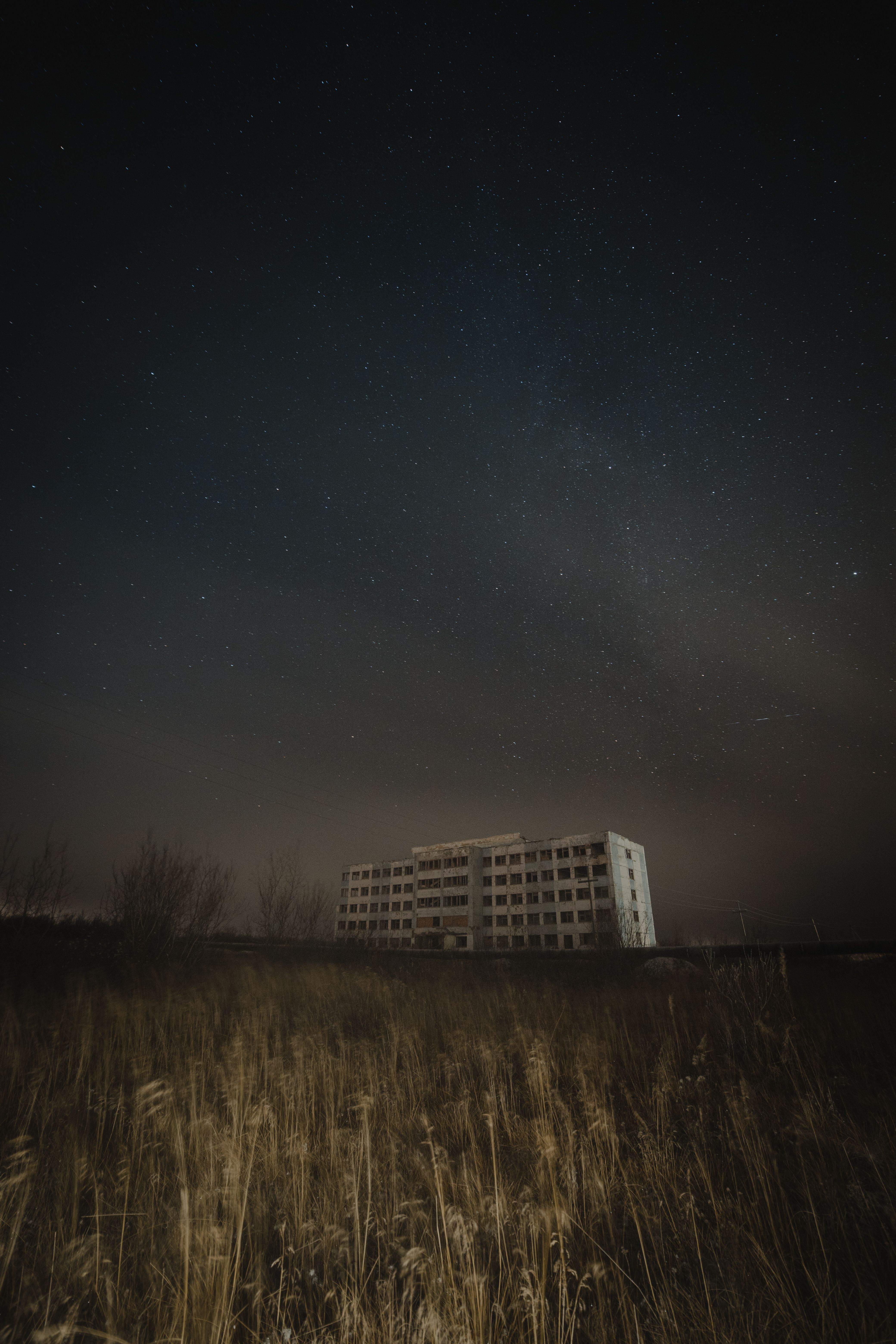 White Concrete Building Under Starry Sky · Free Stock Photo