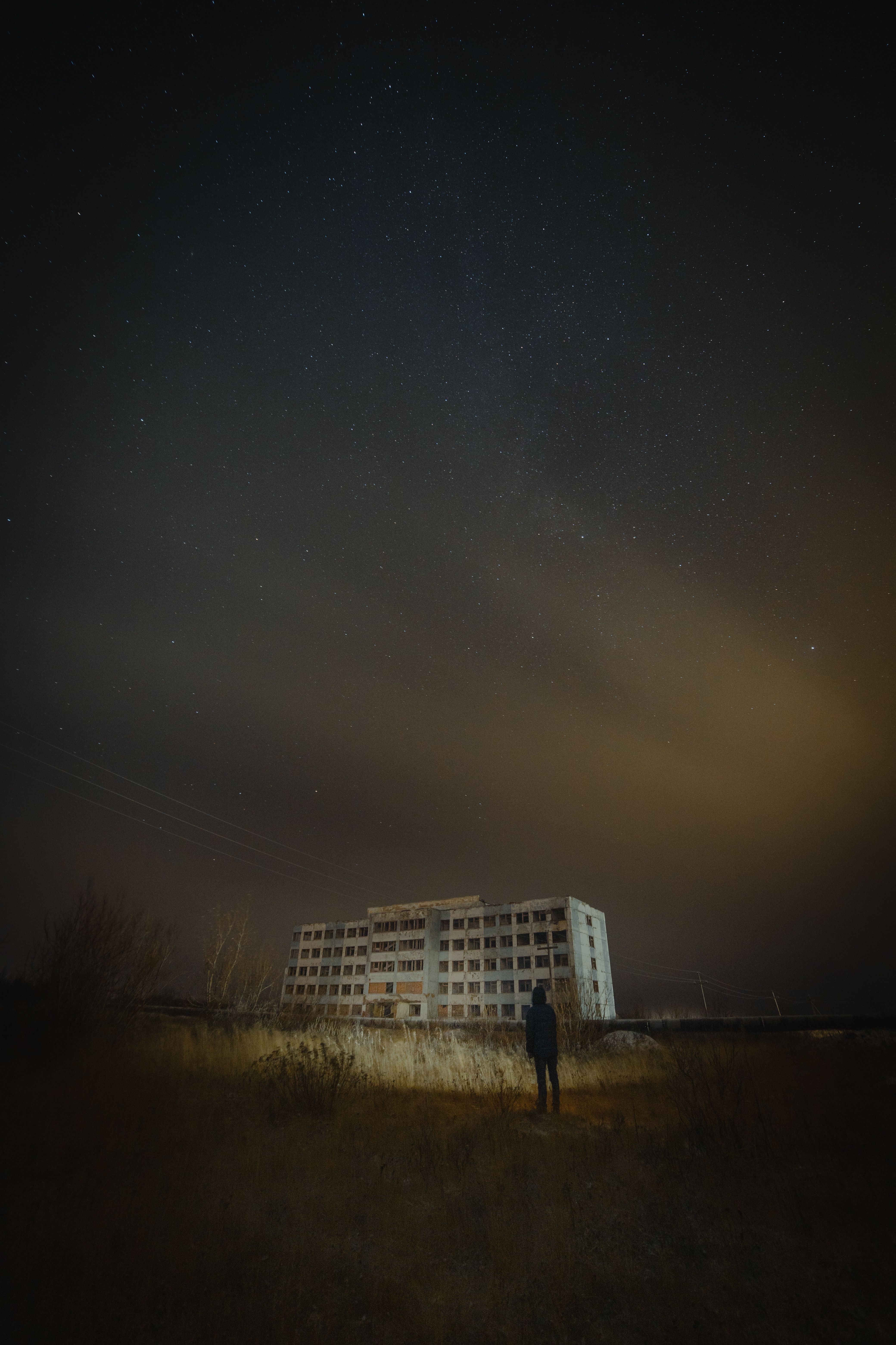 White Concrete Building Under Starry Sky · Free Stock Photo