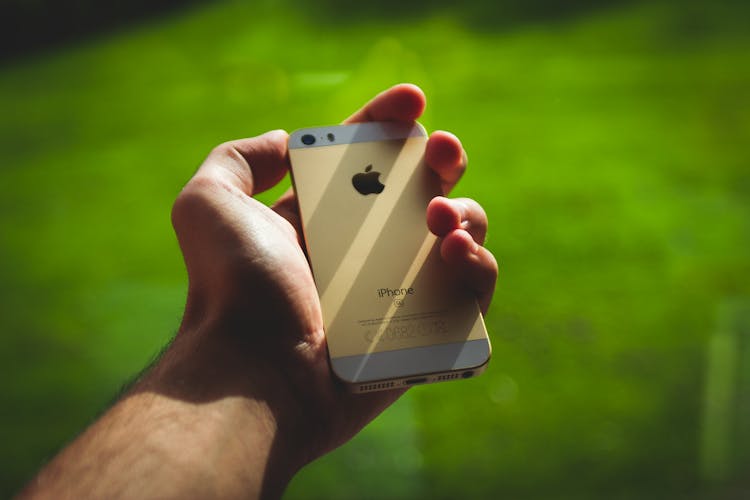 Person Holding Silver Iphone 5s