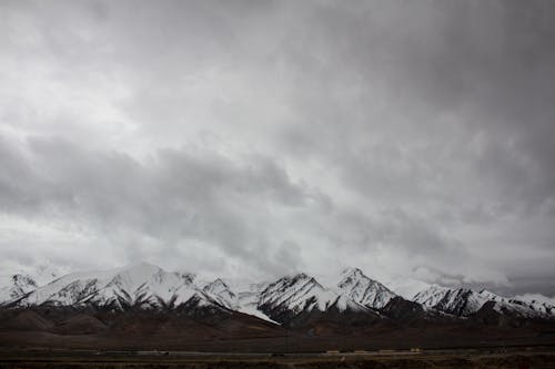 Free Snow Capped Mountains under Cloudy Sky  Stock Photo