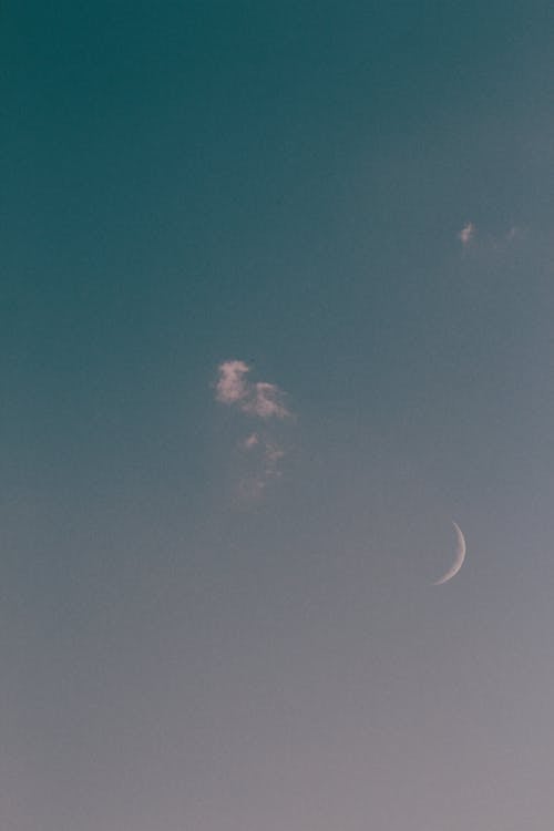 Cloud and Crescent Moon in Sky in Evening