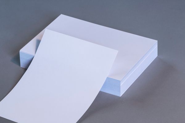 Stacked white A4 paper sheets