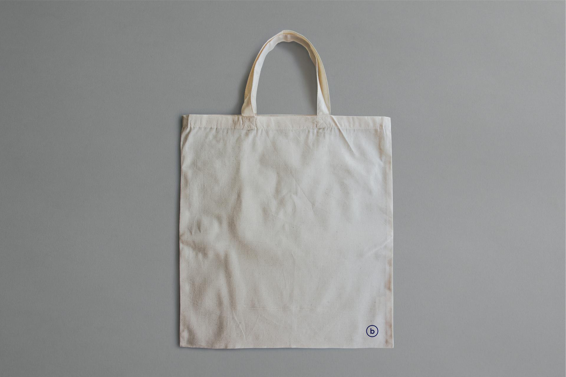 Simple blank canvas tote bag for product display or branding.