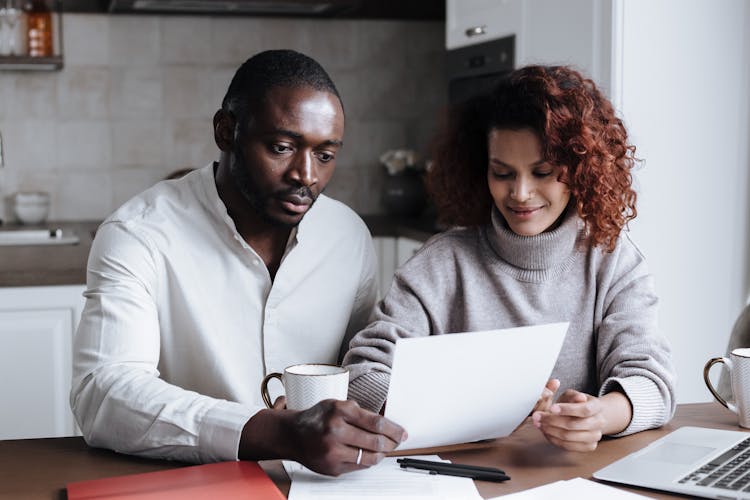 Couple Working Together At Home