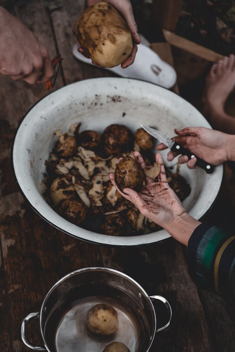 People Peeling Potatoes