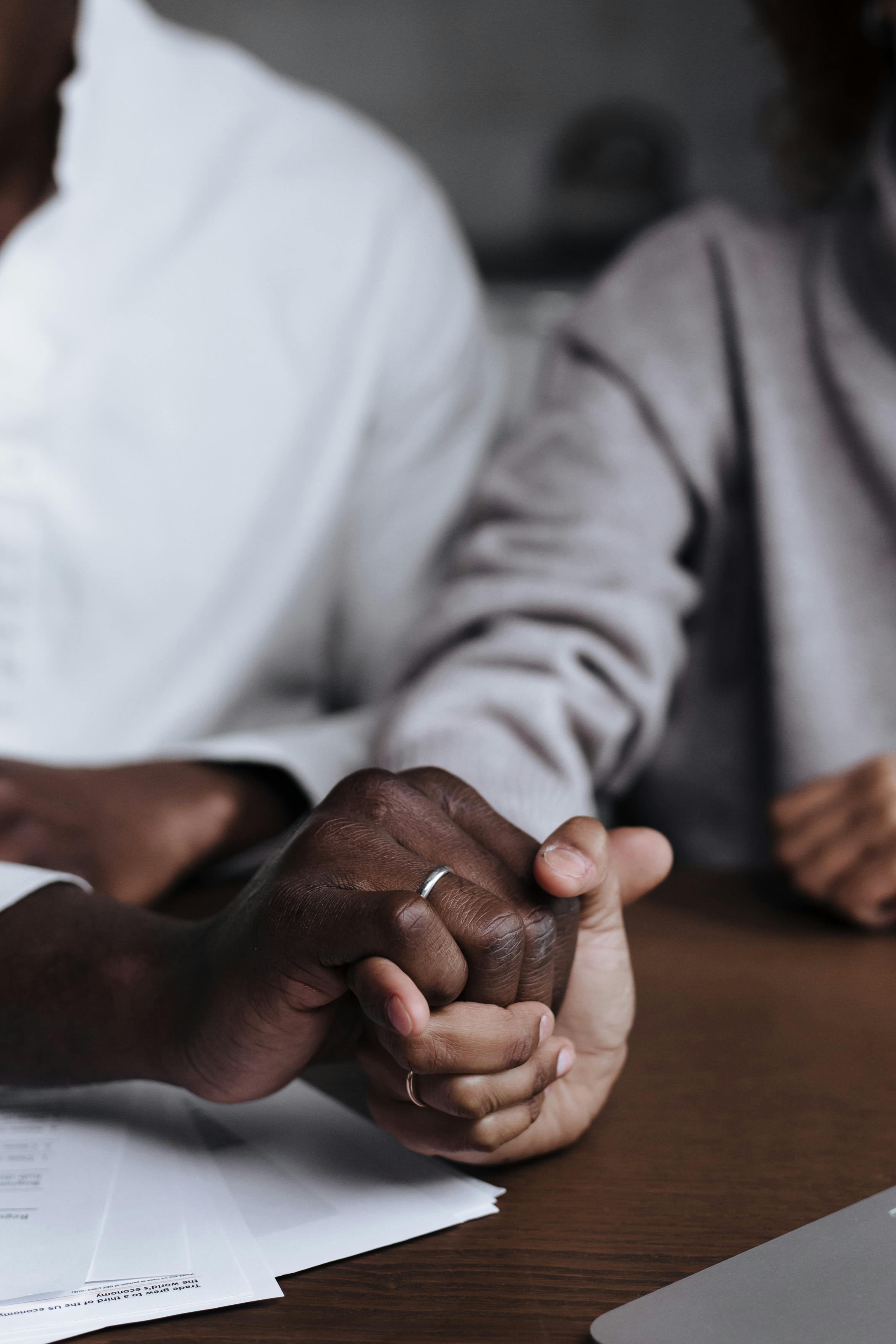 close up view of couple holding hands