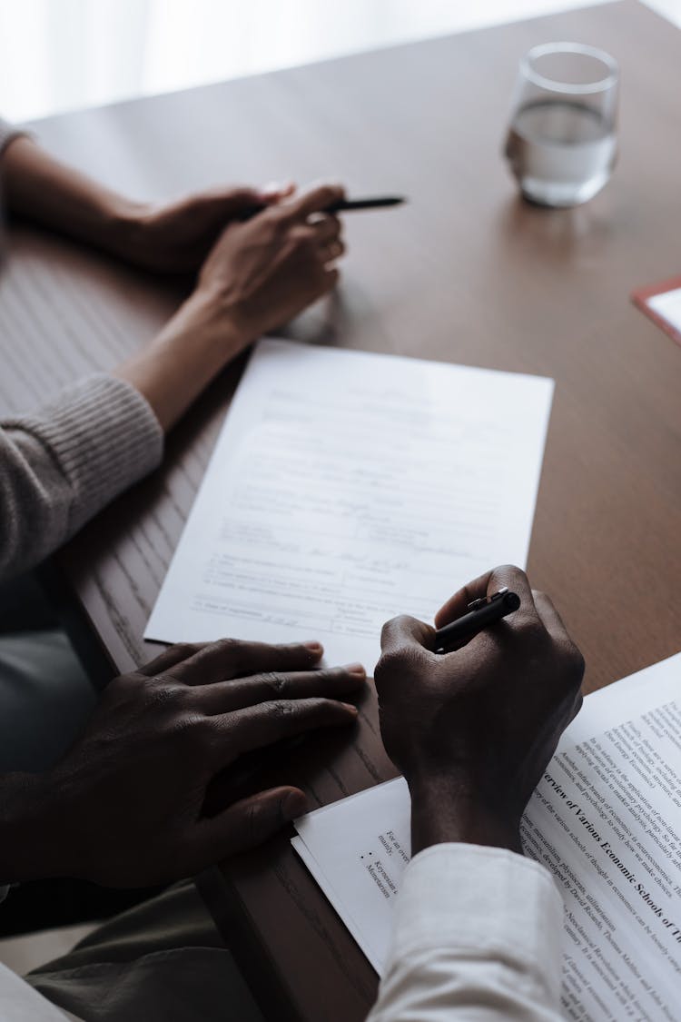 Man Signing Adoption Papers