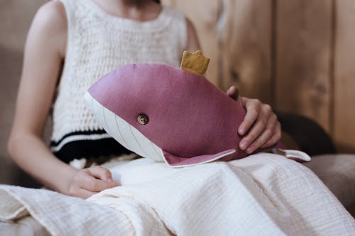 Young Girl Holding Stuffed Toy 