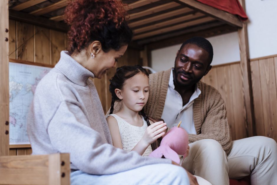 A loving family spending quality time together indoors. Warm and joyful interaction.