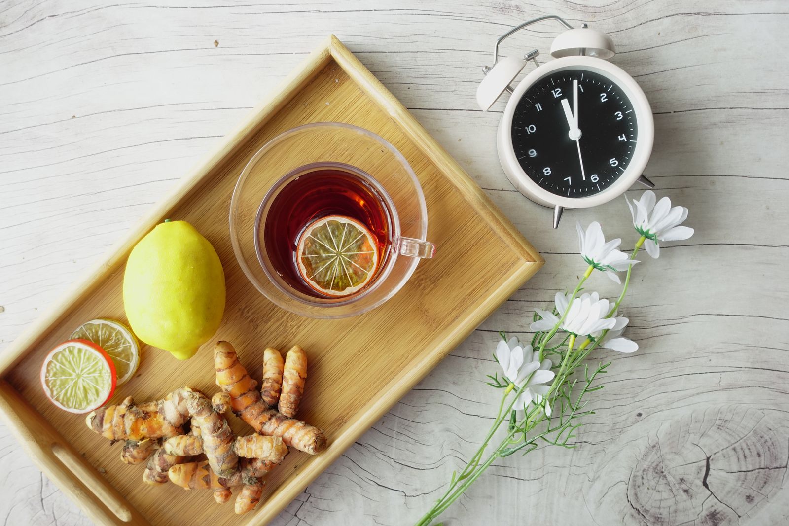Natural ingredients arranged with a herbal drink