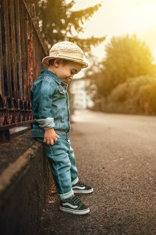 Close-up Photo of Cute Child in Denim Attire