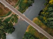 Aerial Footage of Train Tracks over Water Canal