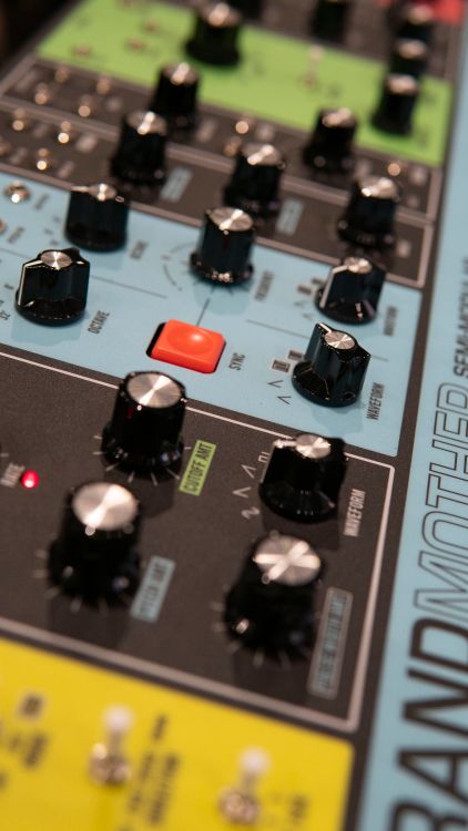 Free Detail view of audio synthesizer equipment with knobs and dials. Stock Photo