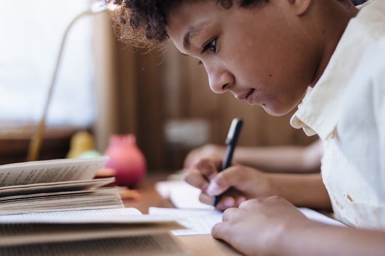 Young Boy Learning To Write