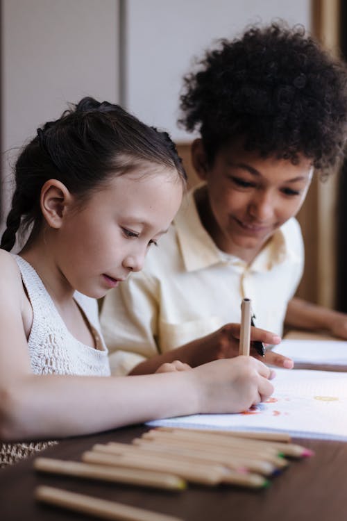 Brother Watching His Sister Draw