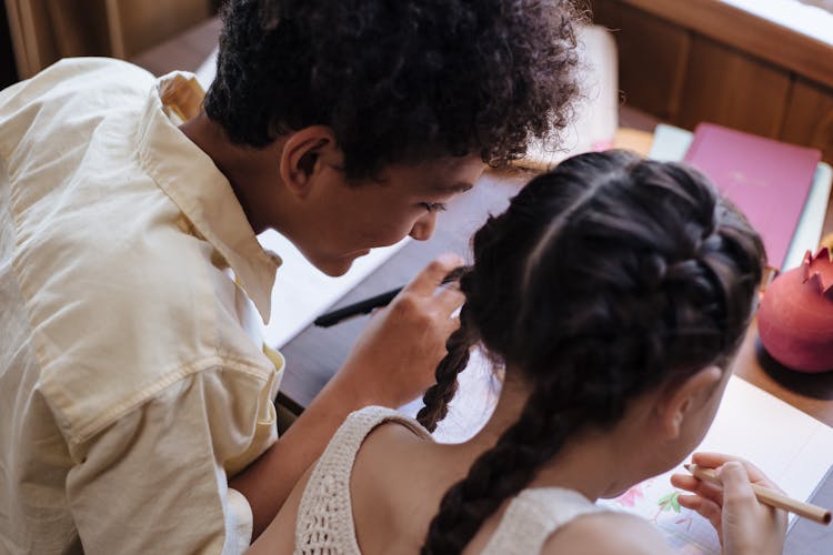 A Brother And Sister Learning and Drawing 