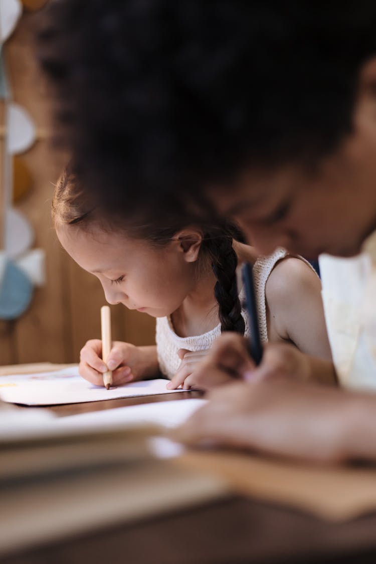 Brother And Sister Writing And Drawing 