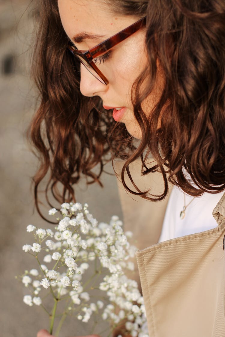 Part Of Woman Holding Gypsophila Flowers