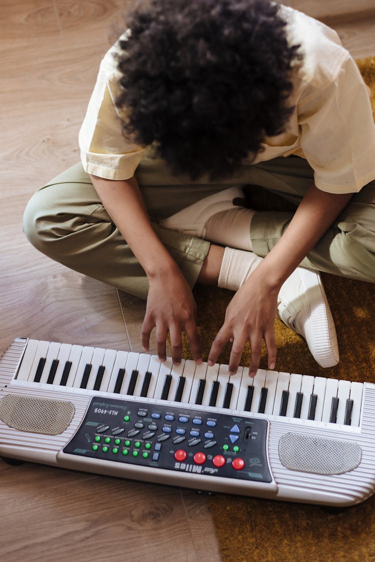 Young Boy Playing Synthesizer