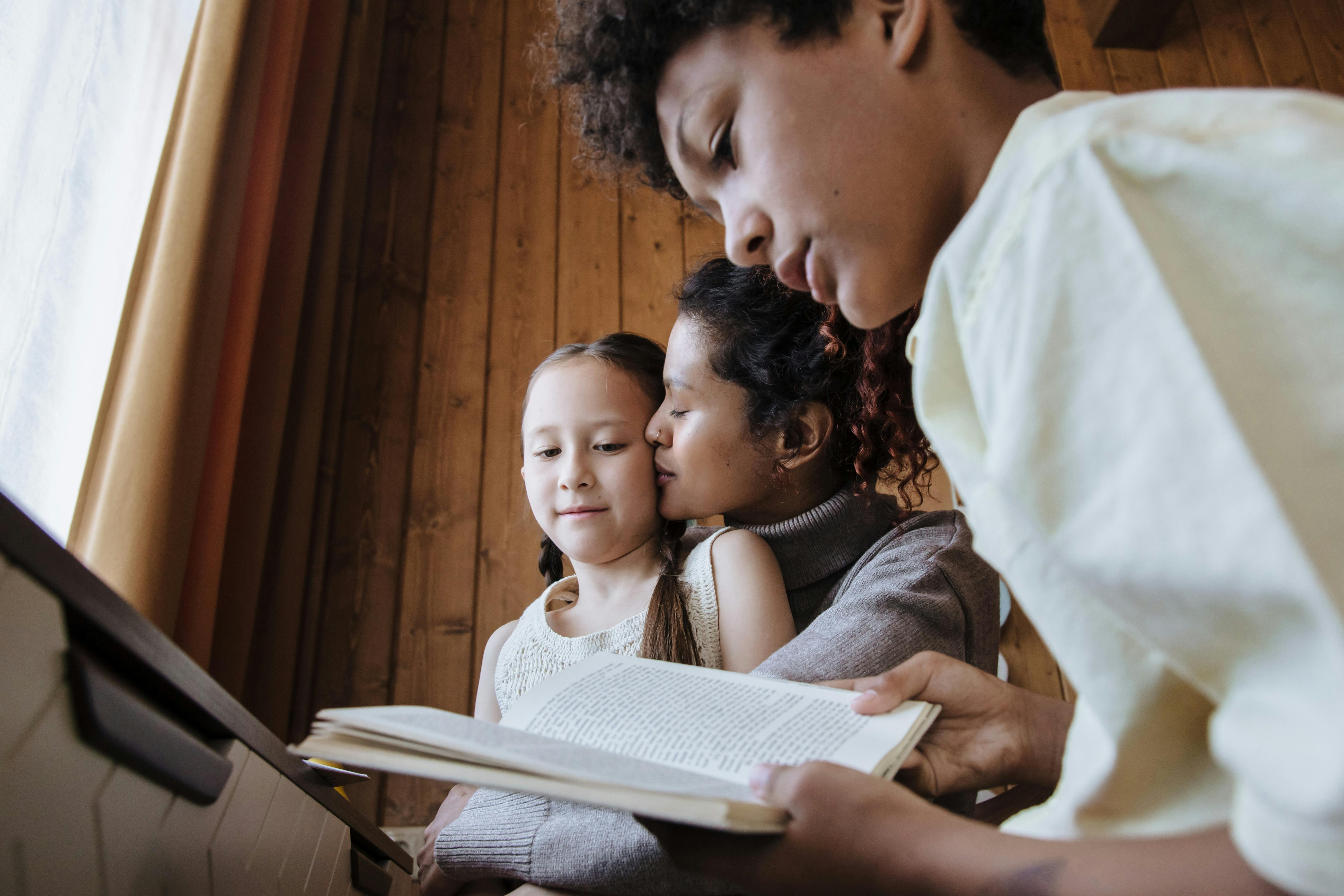 brother and sister learning with their mother