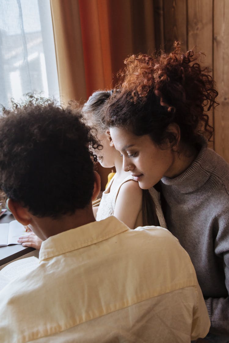 Brother And Sister Learning With Their Mother