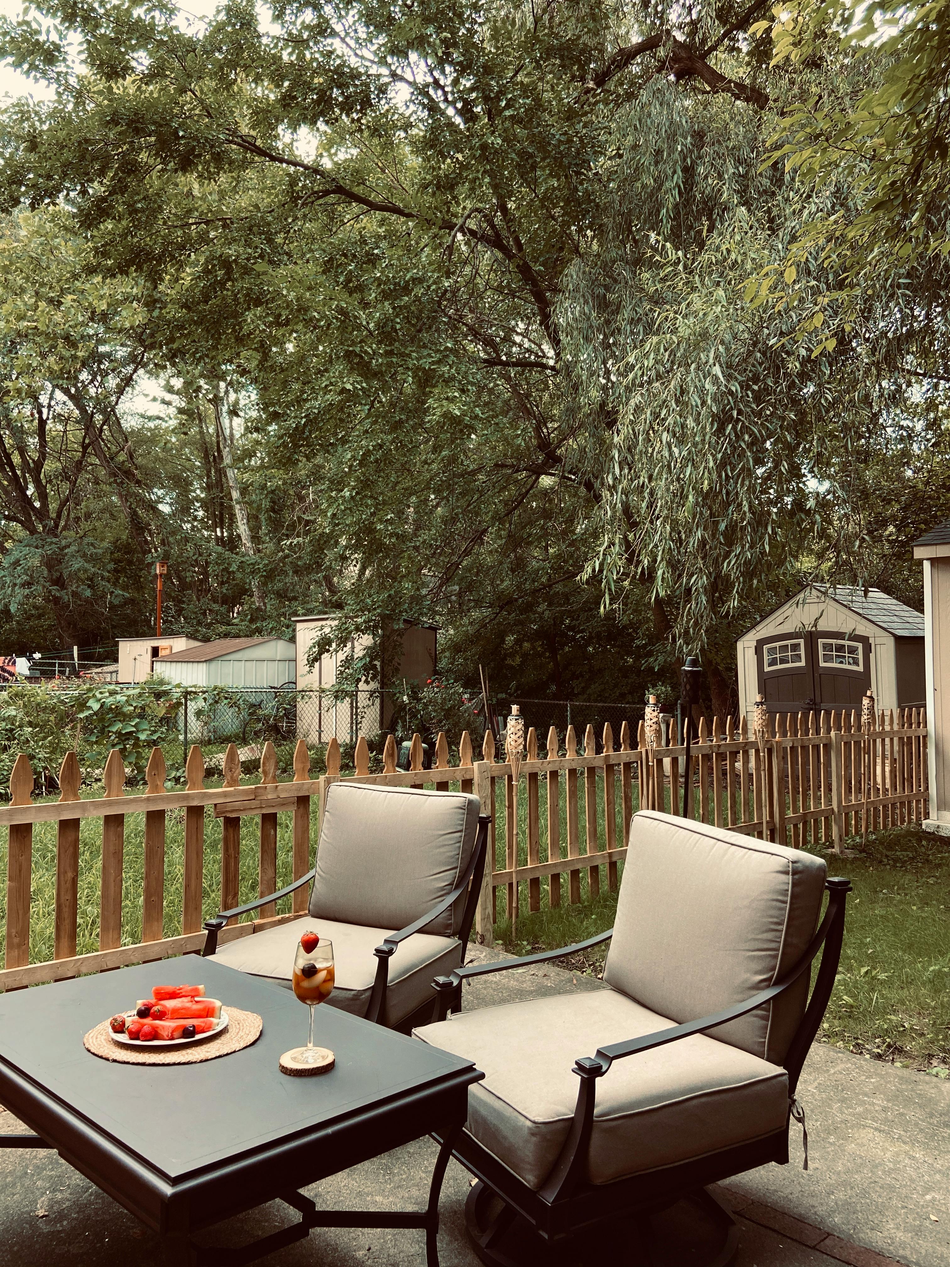 Beautiful backyard patio with outdoor seating in summer