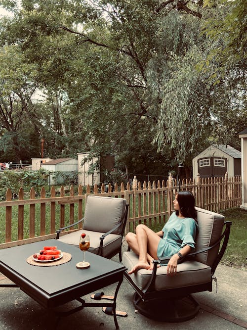 Relaxed Woman sitting in an Armchair 