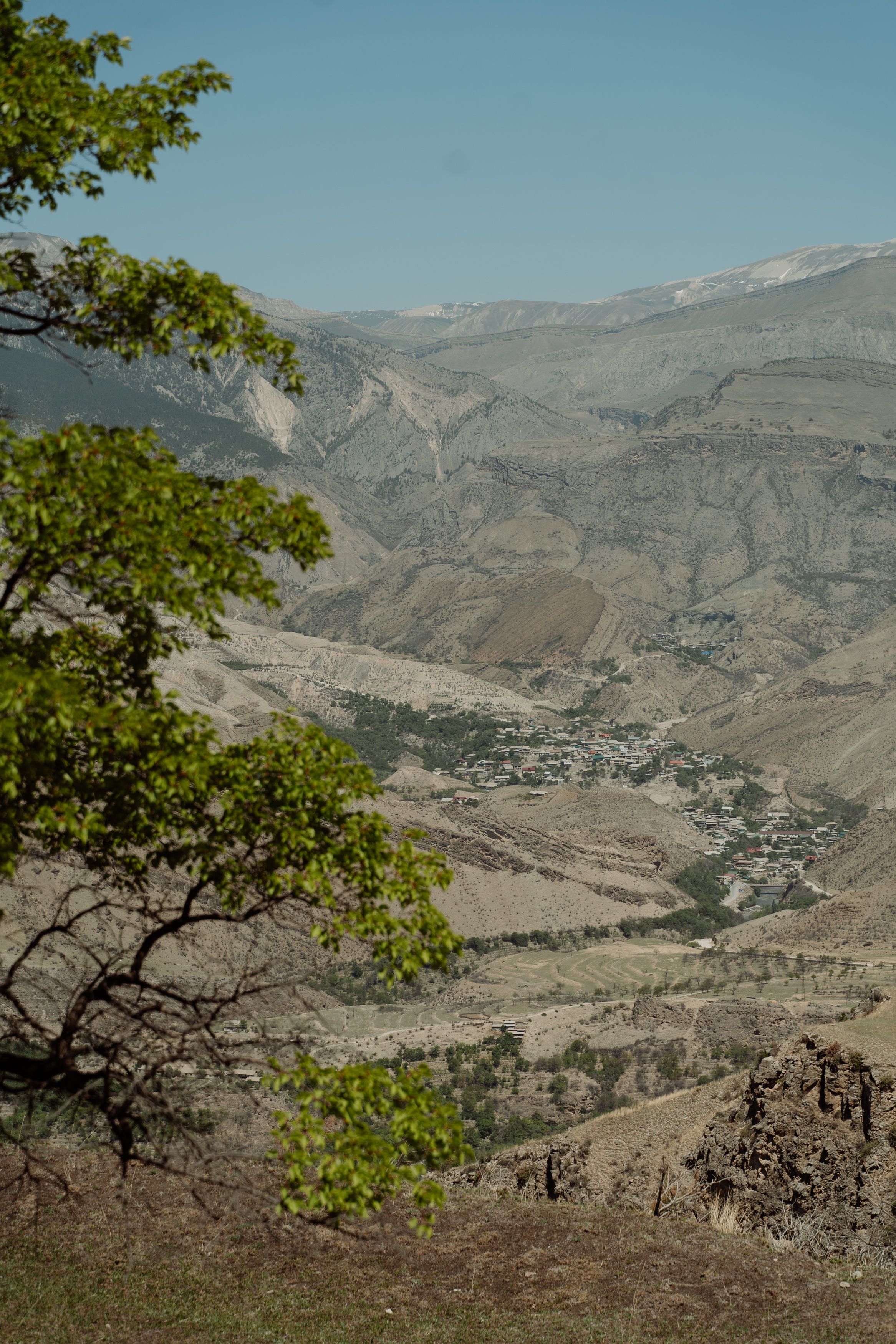 A breathtaking aerial view showcasing mountain ranges with lush greenery.