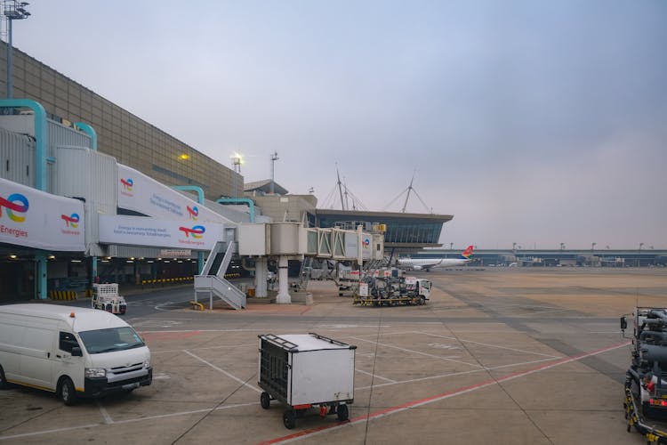 A White Van Parked On Airport Apron