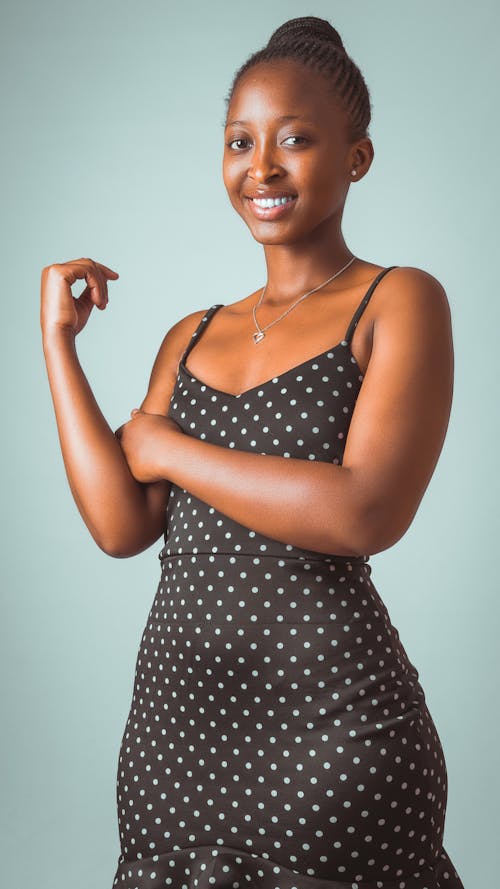 A Beautiful Woman in Black Polka Dot Dress Smiling