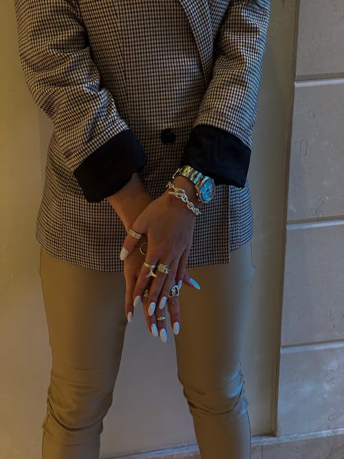 Woman in Checkered Long Sleeve Shirt Wearing Rings