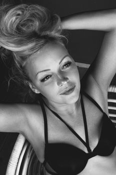 Black and white portrait of a woman in lingerie, capturing elegance and beauty.