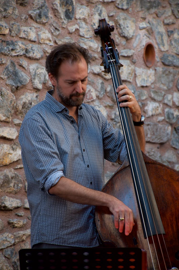 A Man Playing The Bass