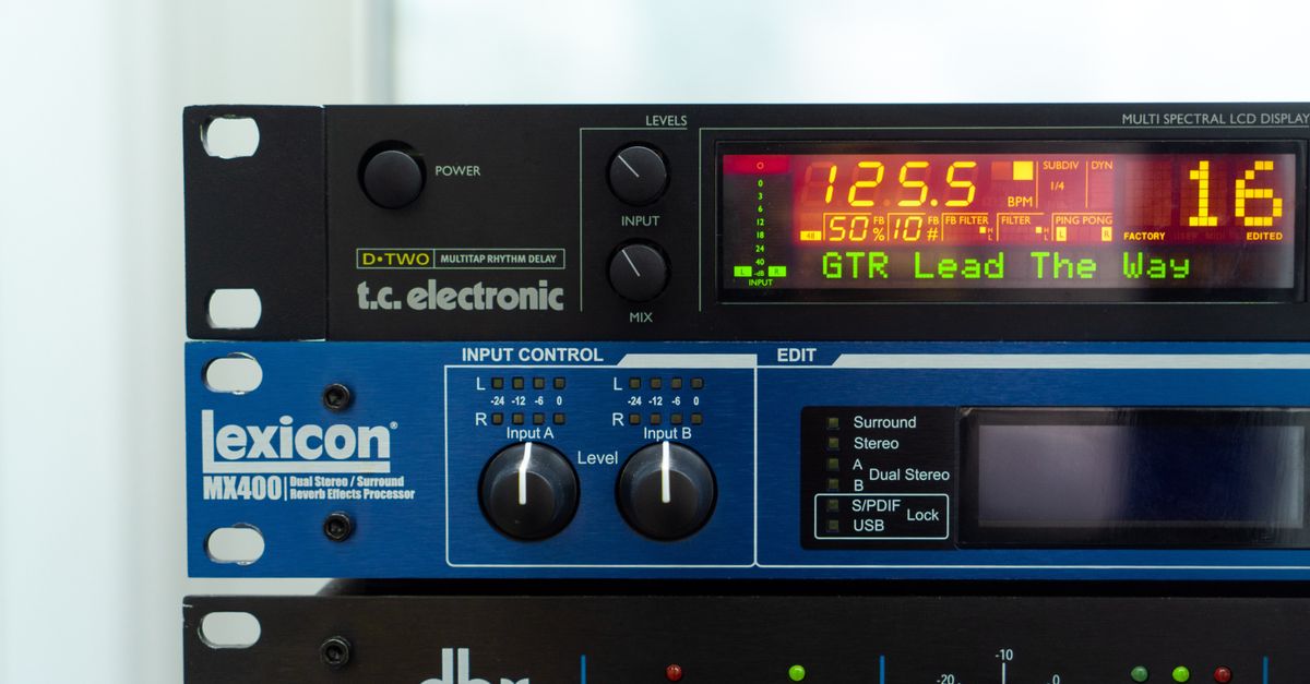 Stacked audio processors in a studio rack with digital displays and controls.