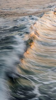 Sunset Light Reflecting in Sea Wave