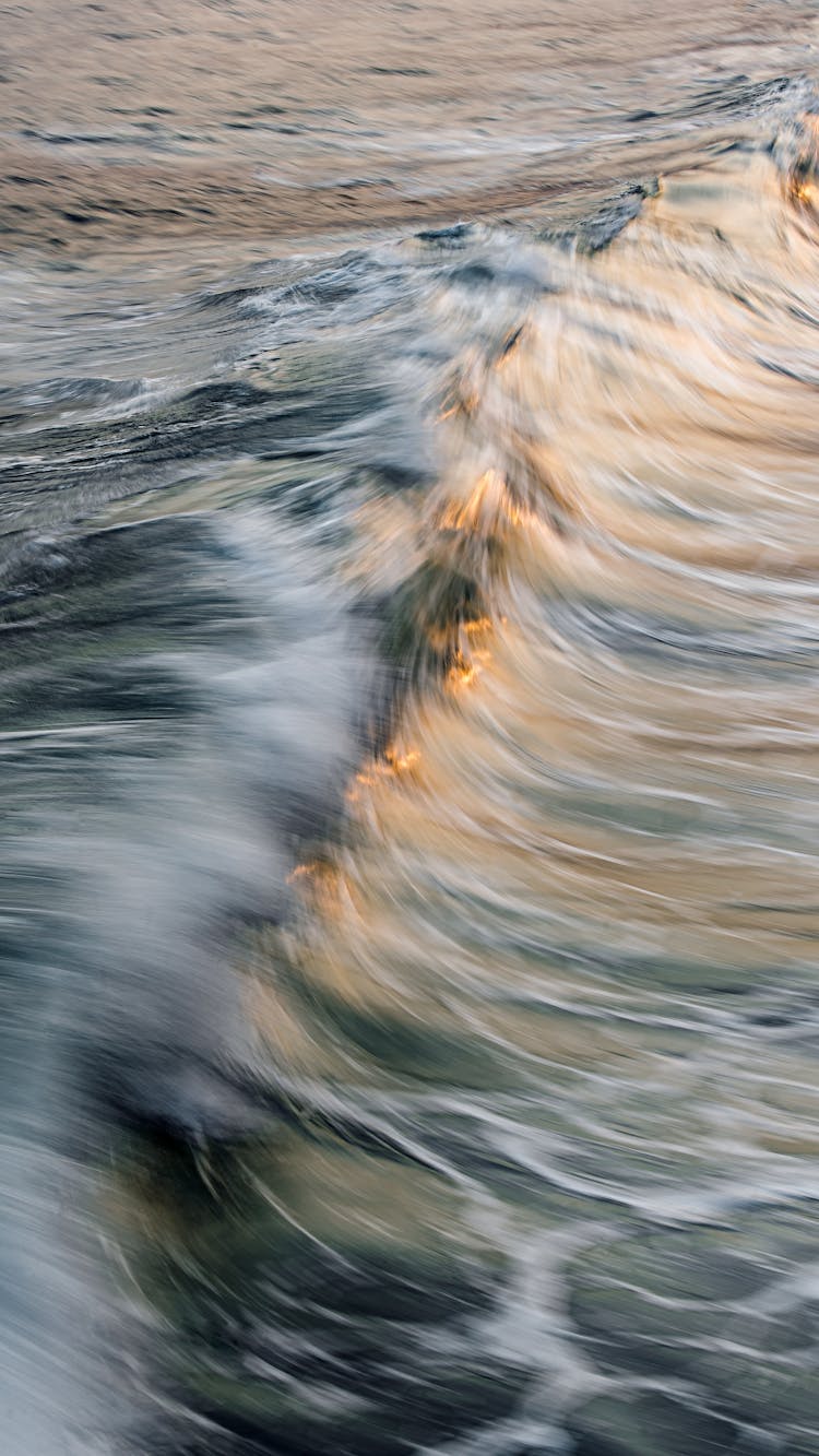 Sunset Light Reflecting In Sea Wave